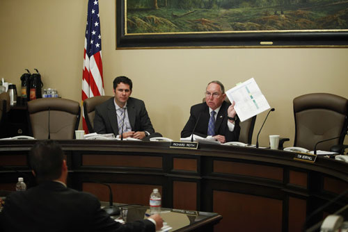 Senator Roth holding chart in committee